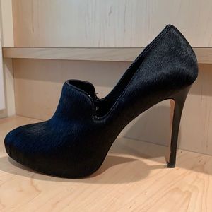 Black calf hair platform pumps. 8